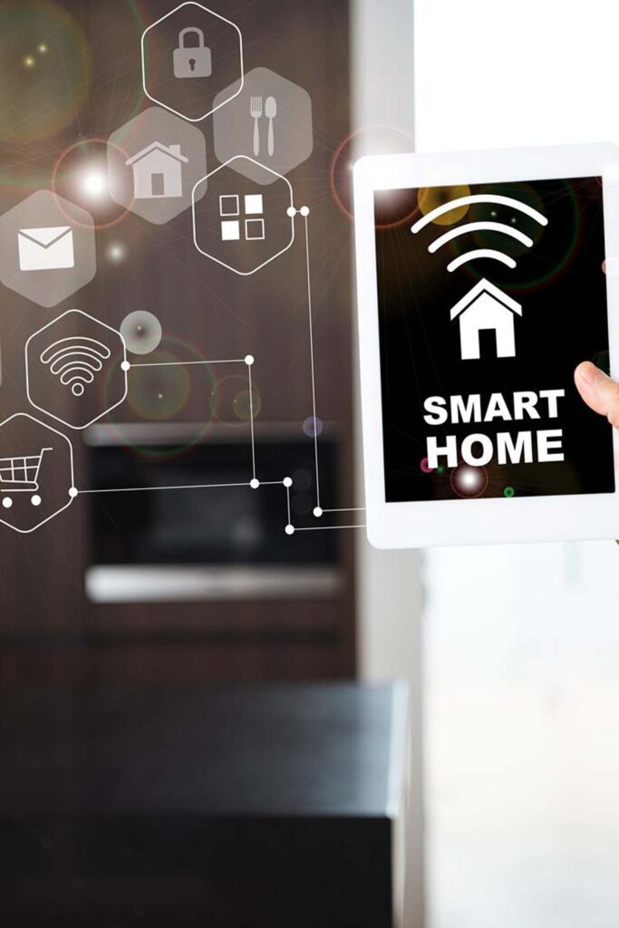 Young woman controlling home with a digital touch screen panel installed on the wall in the living room. Concept of a smart home and mobile application for managing smart devices at home